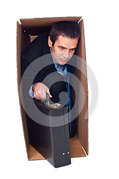 Businessman inside of a cardboard box