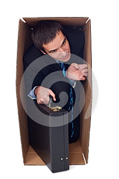 Businessman inside of a cardbox