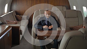 Businessman inside of private jet luxury interior