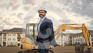 businessman inspect building plan at site. businessman checking building plan outdoor.