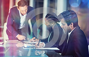 Businessman interacting with coworkers in meeting