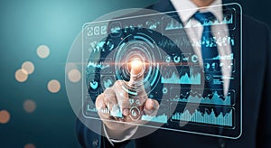 Businessman interacting with futuristic digital touchscreen display with data visualizations