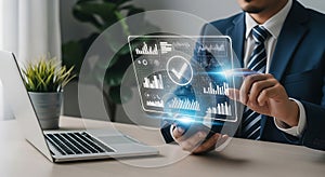 Businessman interacting with a futuristic holographic display showing data and charts