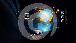 Businessman using tablet with futuristic data visualization and analytics interface, showcasing modern technology and