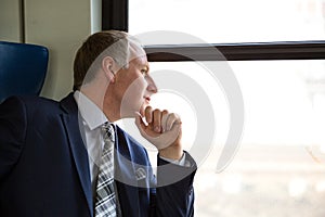 Businessman interested in what he sees through window