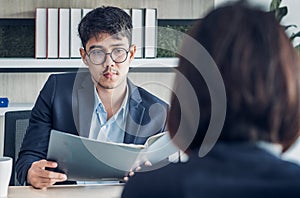 Businessman interview with interviewer candidate see qualification  data that apply for job at meeting room in modern office
