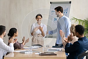 Businessman introduce excited female newcomer to team photo