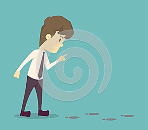 Businessman investigating suspicious footprints.cartoon of business,employee success is the concept of the man characters