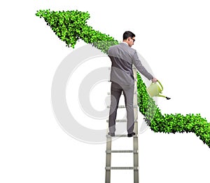 Businessman in investment concept watering financial line chart