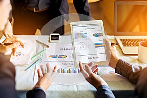 Businessman investment consultant analyzing company financial report balance sheet statement working with digital graphs. Concept