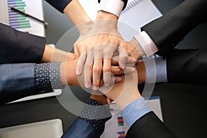 Businessman joining united hand, business team touching hands together. unity teamwork partnership concept