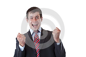 Businessman jubilates happy with chlenched fists