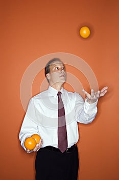 Businessman juggling