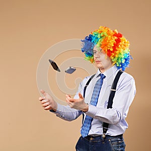 Businessman juggling mobile phones