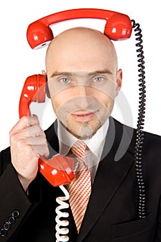 Businessman Juggling Two Calls photo