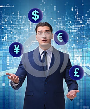 Businessman juggling between various currencies