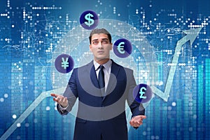 The businessman juggling between various currencies