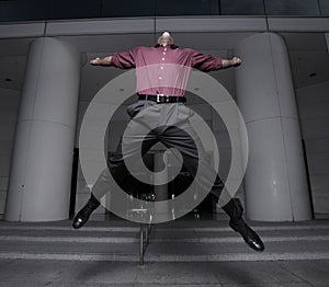 Businessman jumping for joy