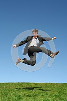 Businessman jumping for joy