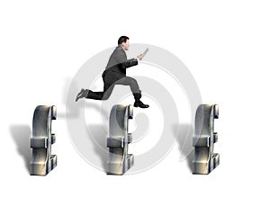 Businessman jumping over 3d pound symbols