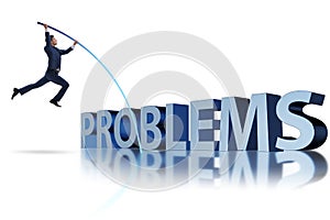 The businessman jumping over problems in business concept