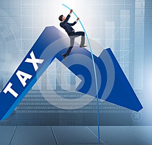 Businessman jumping over tax in tax evasion avoidance concept photo