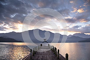 Businessman jumping on the pier