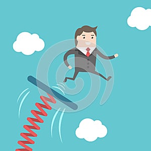 Businessman jumping from springboard