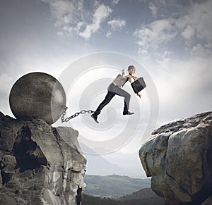Businessman jumps the obstacle