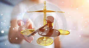 Businessman with justice hammer and weighing scales 3D rendering