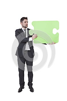 Businessman keeping puzzle piece