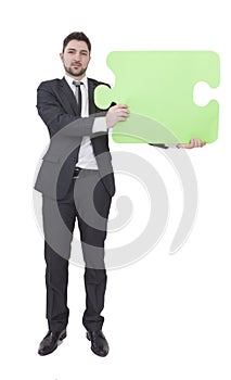 Businessman keeping puzzle piece