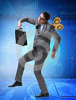 Businessman with key in hardworking concept