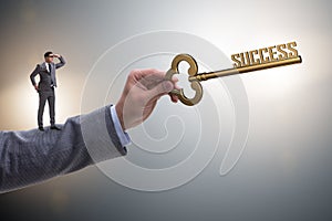 The businessman with key to success business concept