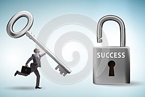 Businessman in key to success concept