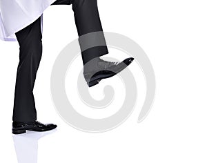 Businessman kicking