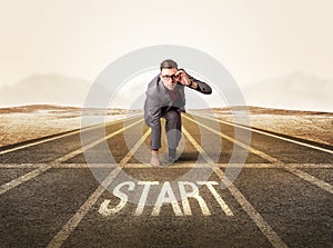 Businessman kneeling in ready position