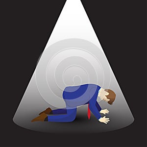 Businessman Kneeling Under Spotlight