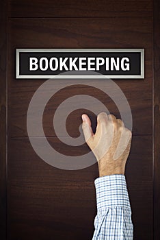 Businessman knocking on Bookkeeping office door