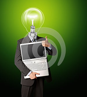Businessman with lamp-head with open laptop