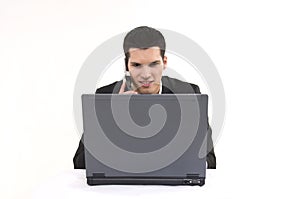 Businessman with lap top computer and phone