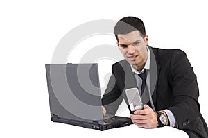 Businessman with lap top computer and phone