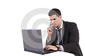 Businessman with lap top computer and phone