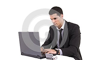 Businessman with lap top computer and phone