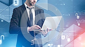 Businessman with laptop, cyber security interface