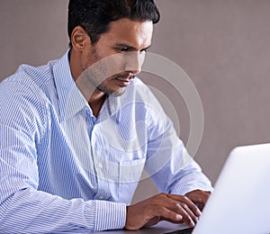 Businessman, laptop and email by desk for productivity and online research on company in office. Entrepreneur, computer