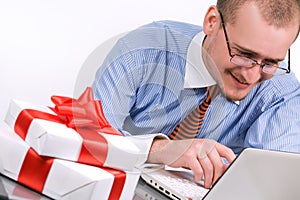 Businessman with laptop and gift box