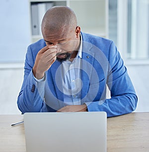 Businessman, laptop and headache in burnout, stress or depression from overworking at the office. Black man employee