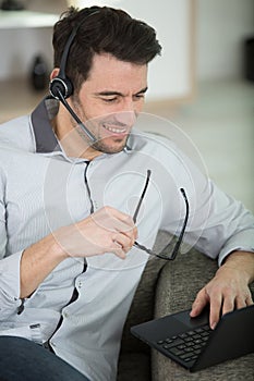 businessman with laptop and headsets