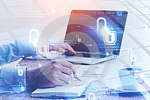 Businessman with laptop in office, cyber security